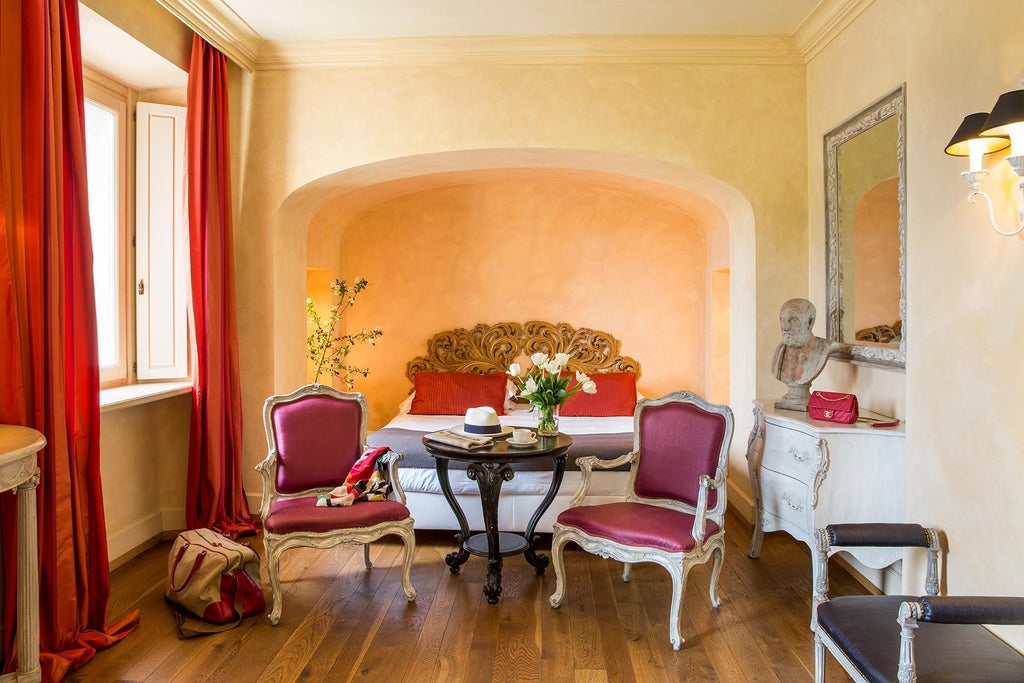 Elegant Superior room at L'Andana hotel in Tuscany, featuring soft neutral tones, plush bedding, and refined Italian design with warm natural light