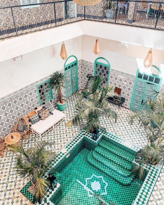 @bemarrakech, the courtyard, and pool at the Riad BeMarrakech, with many comfortable seats, benches, and areas to work from