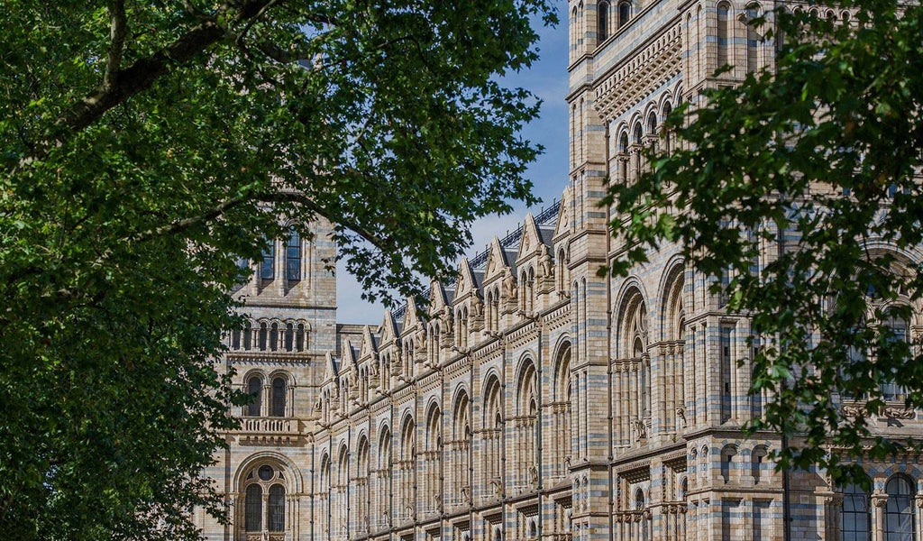 Luxurious boutique hotel facade with elegant Victorian architecture, ornate white exterior, and grand windows in central urban setting of scenset, United Kingdom