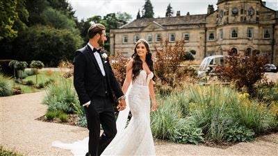 Elegant Victorian manor at Scenset Hall, nestled in lush UK countryside with manicured gardens, classic architecture, and pristine white facade