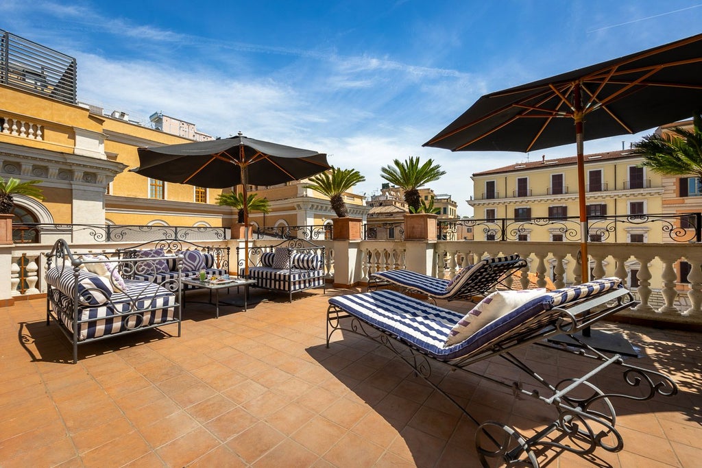 Elegant marble-clad luxury suite with plush white furnishings, ornate chandeliers, and expansive windows overlooking an Italian cityscape in a historic palazzo.