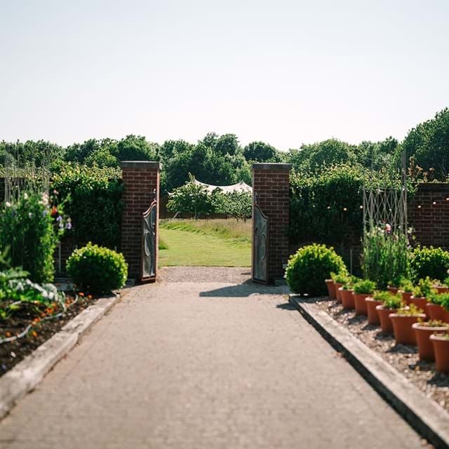 Luxurious countryside hotel with elegant architecture, manicured gardens, and a spa nestled in the lush scenset landscape of the United Kingdom.