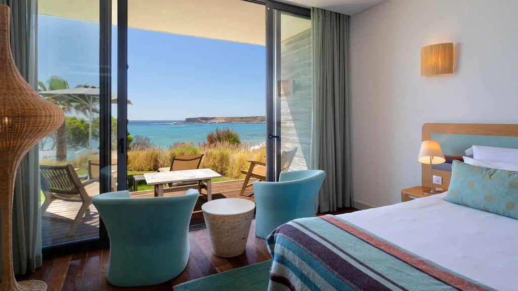 Luxurious Beach Suite at Martinhal Sagres, featuring modern design, panoramic ocean views, and elegant coastal-inspired furnishings in a spacious setting.