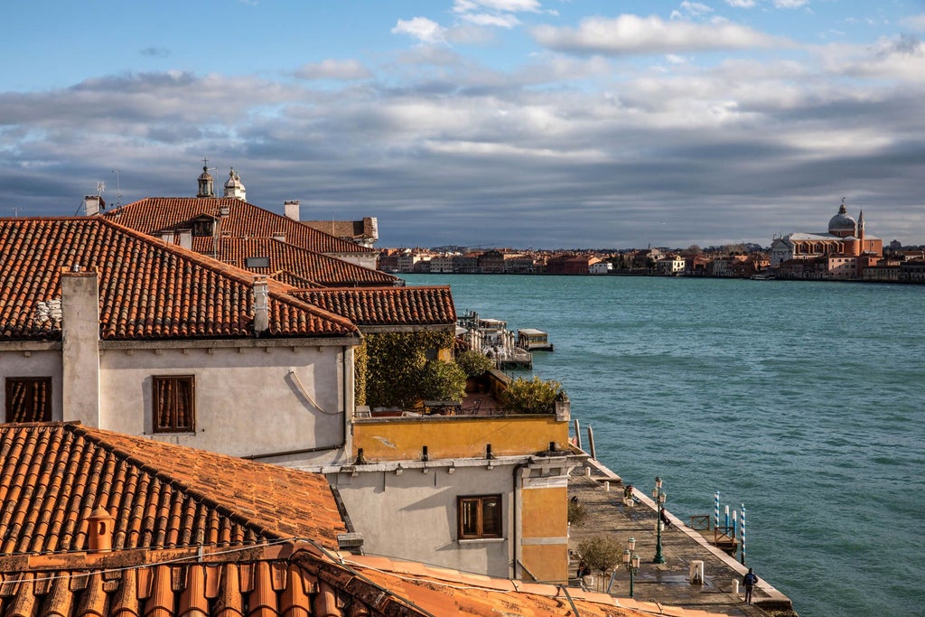 Elegant Venetian palazzo with ornate marble exterior, golden sunset reflecting on canal waters, classic Italian architectural grandeur in scenic Venice