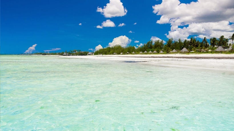 Lay out on the white sands of Zanzibar
