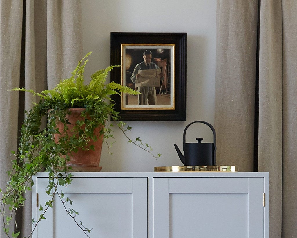 Luxurious Lake Room at Heckfield Place, UK, featuring elegant neutral decor, soft natural light, and serene landscape views through large windows.