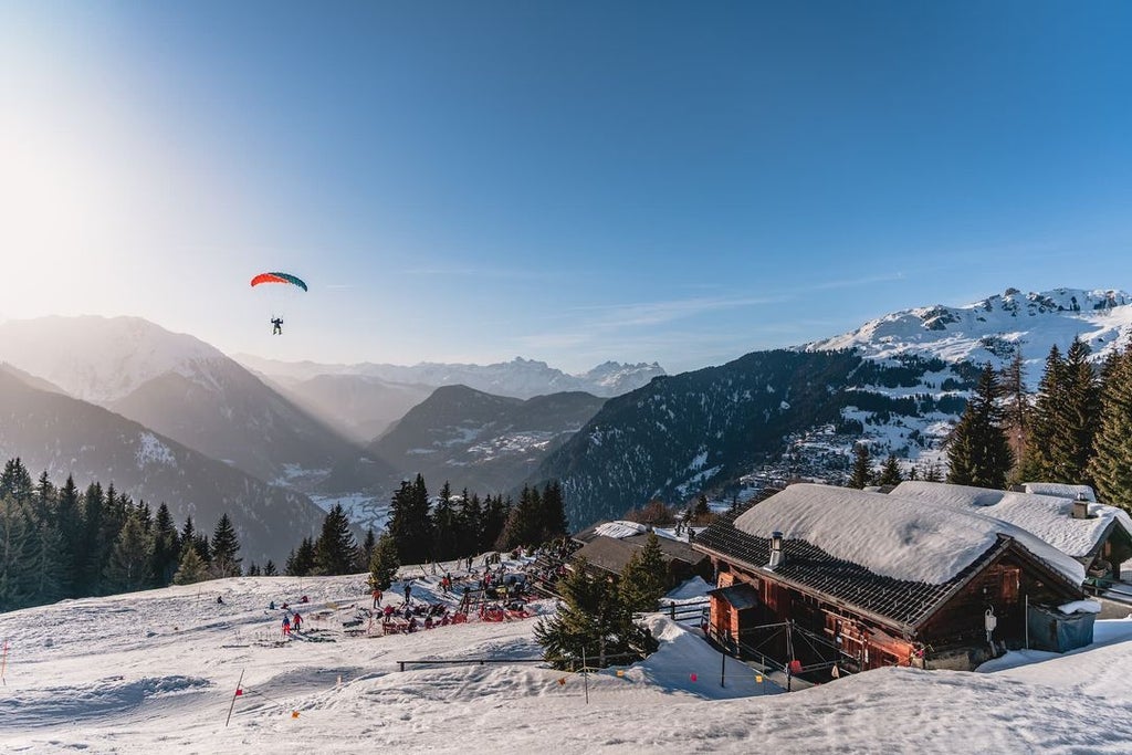 Luxurious alpine chalet with panoramic mountain views, featuring modern minimalist design, sleek wooden interiors, and expansive floor-to-ceiling windows overlooking Swiss landscape