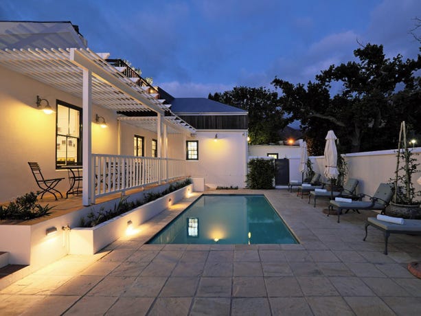 Wade in the pool under the Franschhoek sun after your wine tastings
