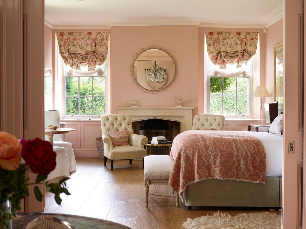 Luxurious hotel room with delicate English rose decor, soft cedar wood accents, and elegant neutral color palette showcasing sophisticated British interior design