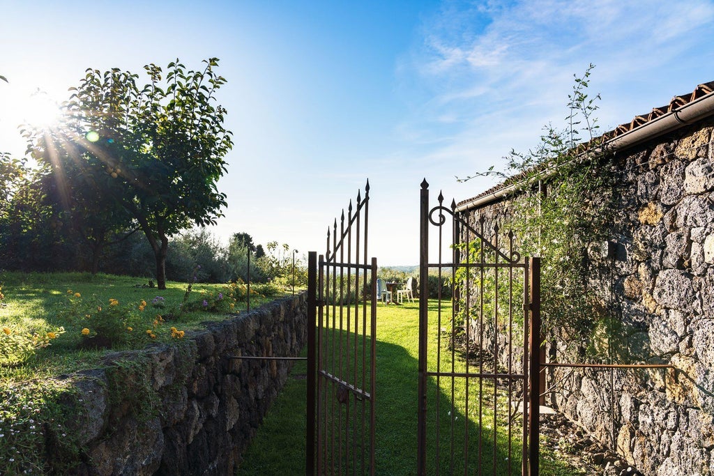 Luxurious Sicilian villa suite with private pool, surrounded by lush vineyards and Mount Etna's volcanic landscape at Monaci delle Terre Nere resort