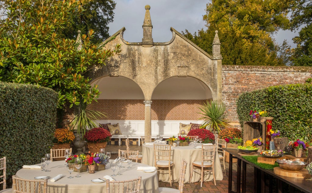 Elegant 18th-century Georgian manor hotel nestled in Hampshire countryside, with manicured gardens and classical stone architecture