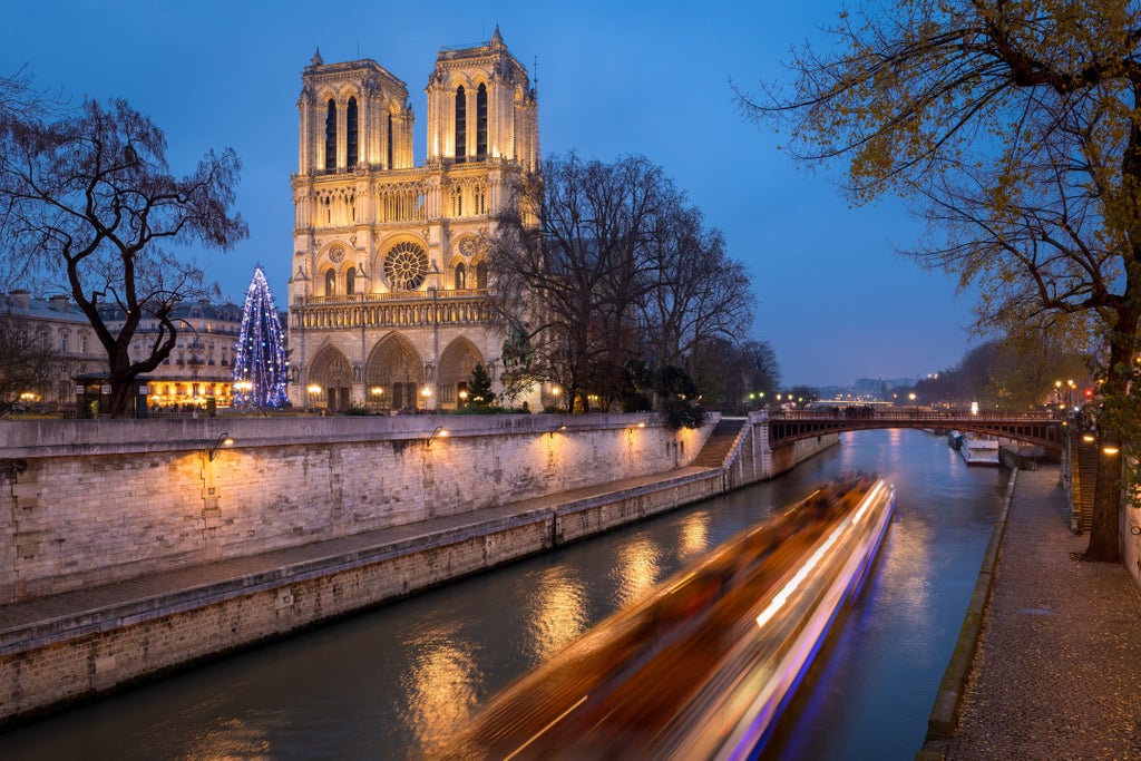 Elegant sunset Seine river cruise with Parisian landmarks, luxurious boat gliding past illuminated Eiffel Tower and historic stone bridges