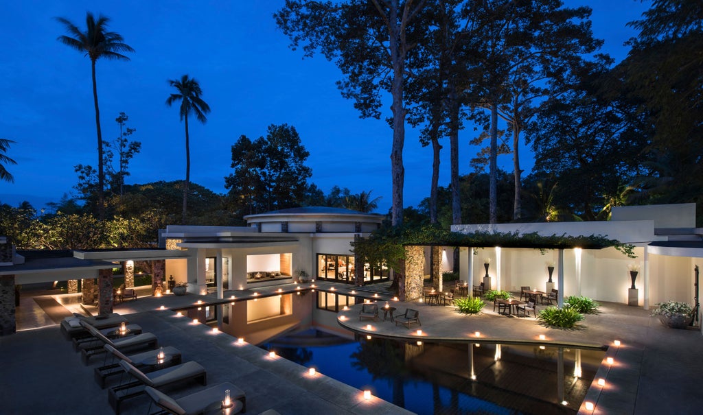 Luxury villa at Amansara resort, featuring sleek modernist architecture, private pool, and lush tropical gardens in Siem Reap, Cambodia