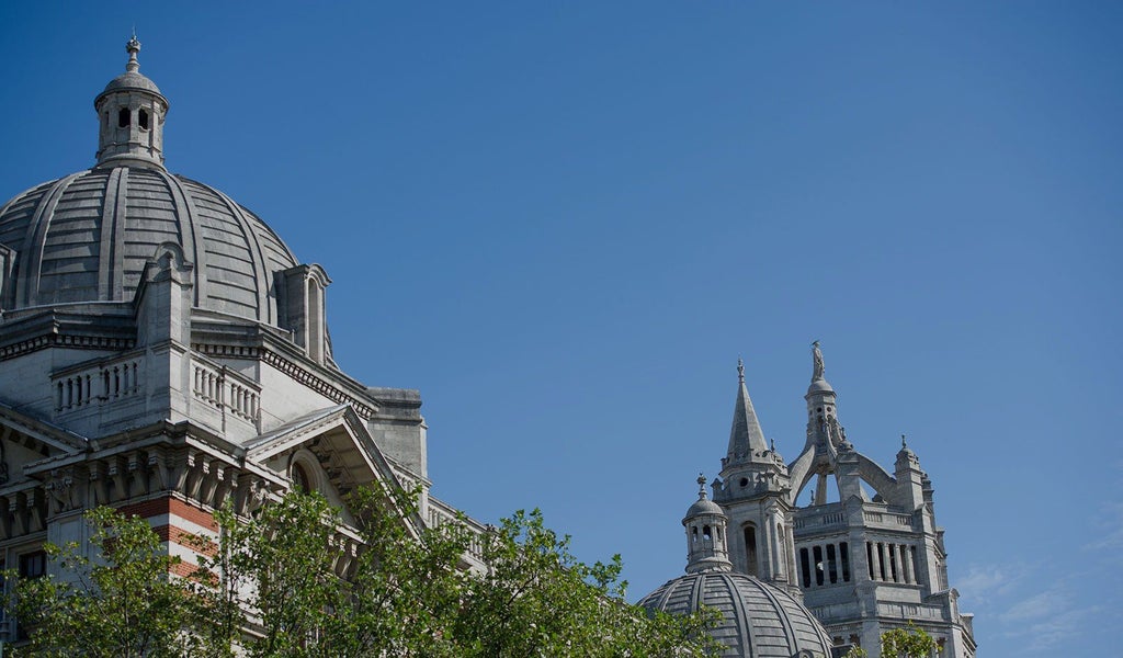 Elegant boutique hotel exterior with Victorian architecture, intricate facade details, and sophisticated lighting in central United Kingdom setting