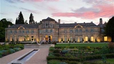 Elegant Grantley Hall, a luxurious historic manor nestled in lush Yorkshire countryside, showcasing grand architecture and manicured gardens with pristine white exterior