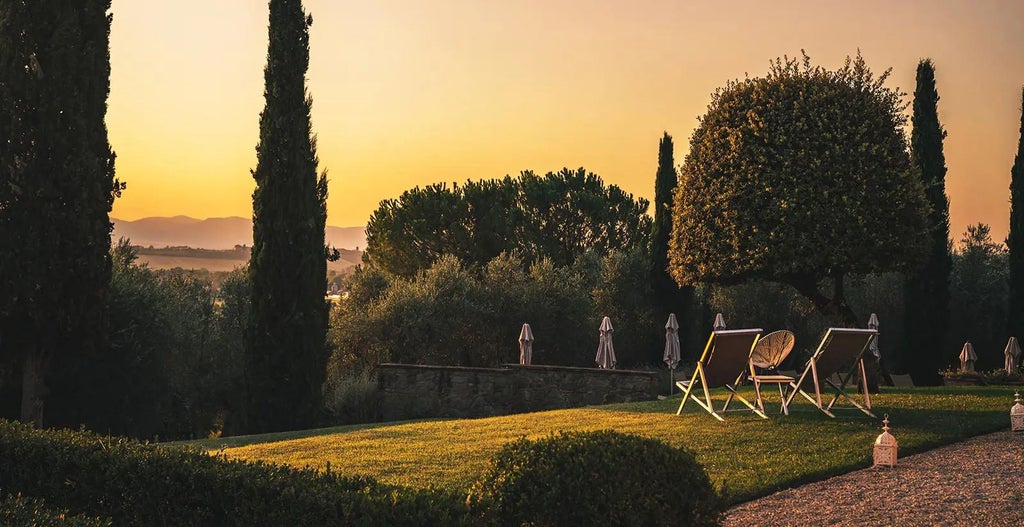 Elegant Tuscan villa with terracotta roof, stone walls, surrounded by cypress trees and lavender gardens under golden afternoon sunlight