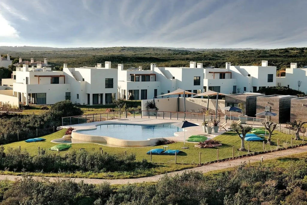 Spacious one-bedroom apartment at Martinhal Sagres Beach Resort, featuring modern design, ocean view, elegant furnishings, and contemporary Portuguese coastal style