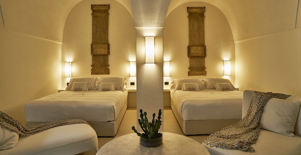 Luxurious master suite with soft neutral tones, elegant minimalist design, large bed, panoramic window overlooking serene Sicilian landscape at sunset