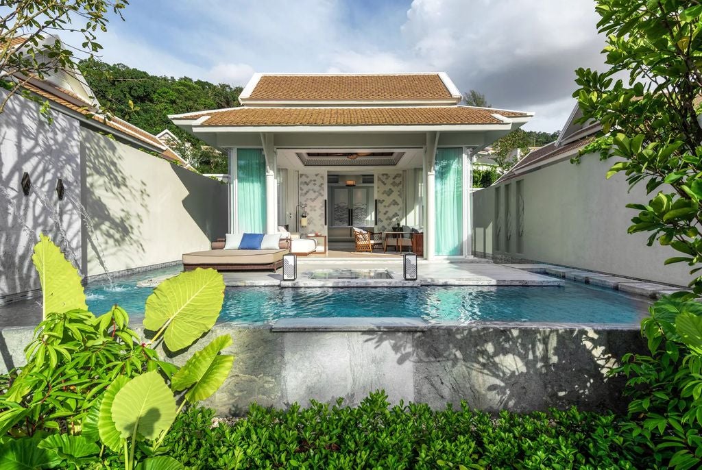 Luxurious beachfront villa with private infinity pool overlooking Andaman Sea, contemporary Thai design, and expansive glass walls