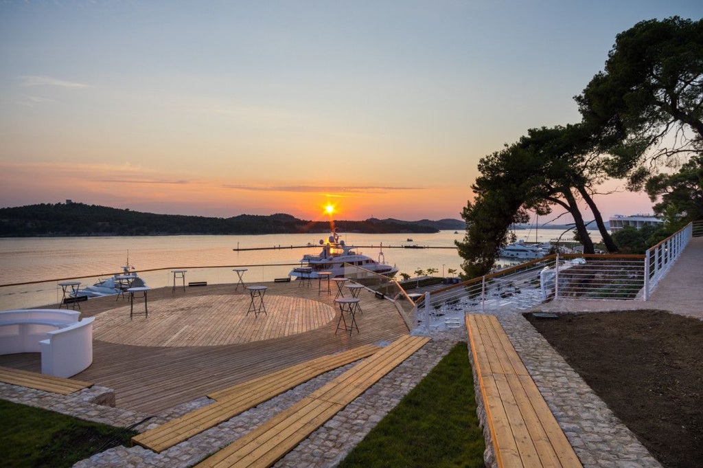 Luxurious coastal resort with modern architecture overlooking the Adriatic Sea, featuring sleek design, azure waters, and scenic Croatian landscape near Šibenik