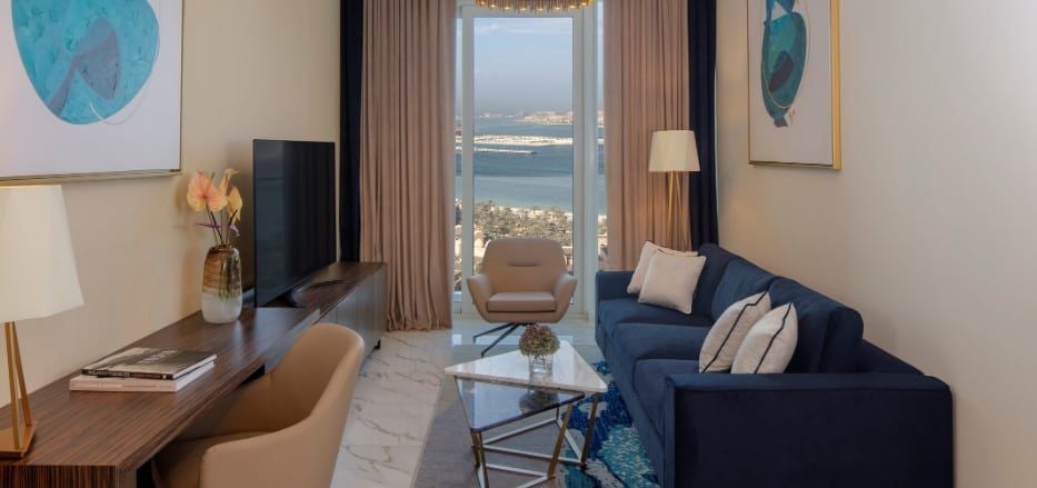 Luxurious one-bedroom sea view apartment at Scenset+ Palm View Dubai Hotel & Suites with modern decor, panoramic cityscape, and elegant furnishings