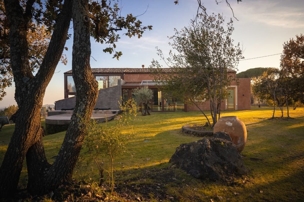 Luxurious poolside suite at Monaci delle Terre Nere, elegant stone terrace overlooking volcanic Sicilian landscape with modern minimalist design