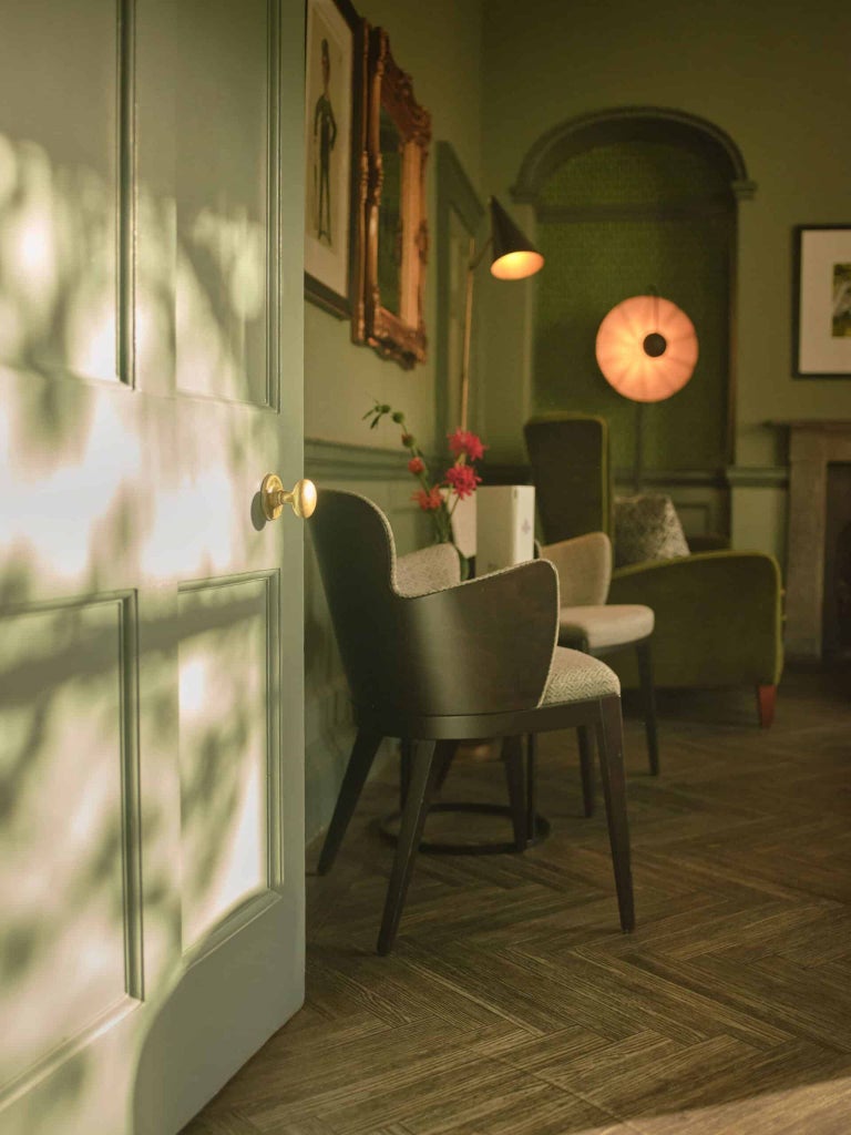 Elegant Georgian townhouse hotel with cream facade, large windows, and classic architectural details in historic United Kingdom urban setting