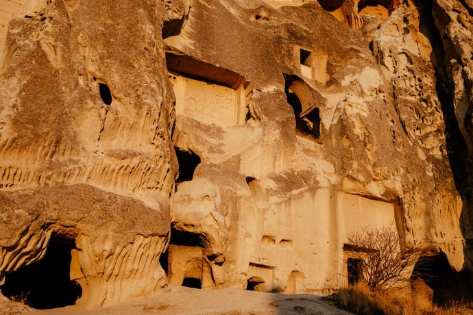 Entrances to one of Cappadocia's underground cities, where churches filled with beautiful frescoes and homes with trap doors are waiting to be explored