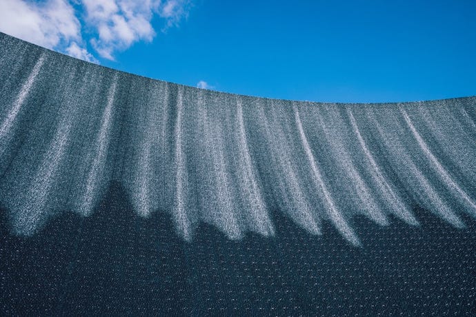 The surreal water feature represents a tsunami in the desert