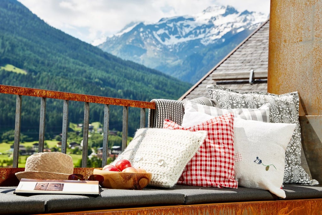 Elegant alpine hotel nestled in Austrian mountains, featuring timber balconies, traditional architecture and panoramic mountain views