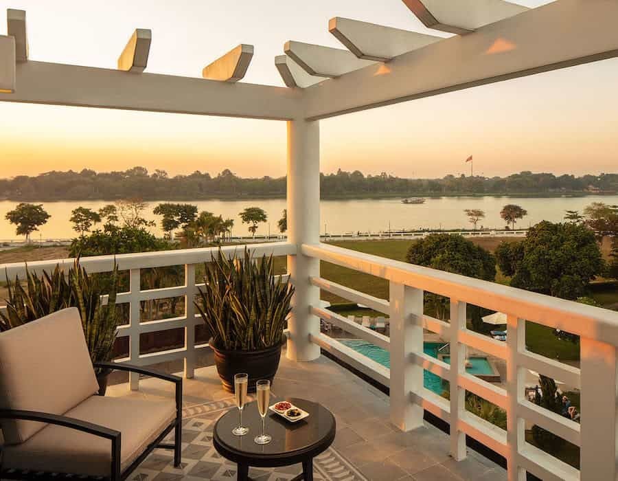 Elegant deluxe river view hotel room at Azerai La Residence, featuring sophisticated decor, traditional Vietnamese design, and sweeping Perfume River panorama