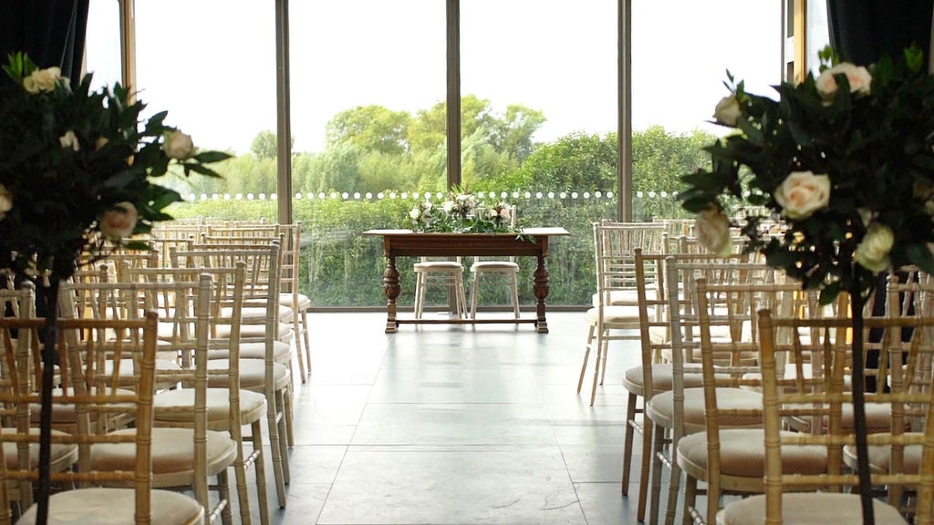 Elegant stone manor house with manicured gardens, showcasing rustic luxury and contemporary design against lush English countryside backdrop