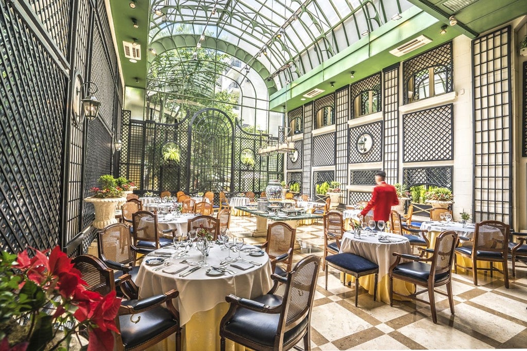 Elegant European-style hotel facade with ornate Belle Époque architecture, white marble columns and grand balconies in Buenos Aires