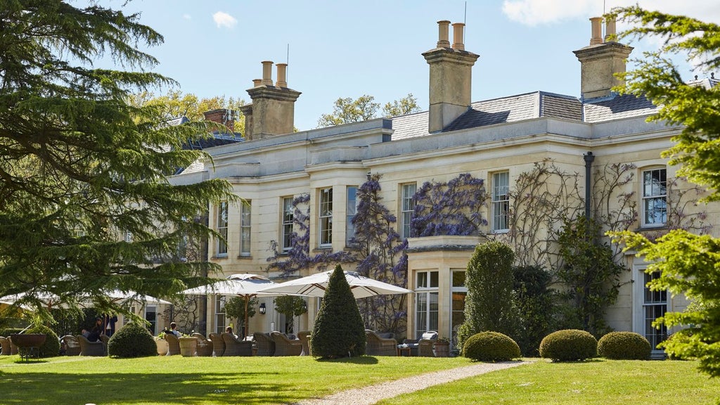 Luxurious forest-edge country hotel with modern rustic architecture, nestled in lush greenery with elegant wooden exterior and contemporary design elements