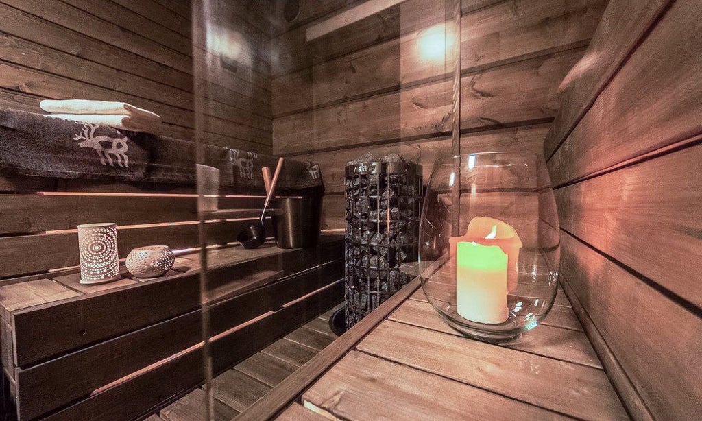 Luxurious Nordic wooden cabin suite with panoramic glass walls overlooking snowy forest, modern minimalist design featuring warm lighting and cozy interior