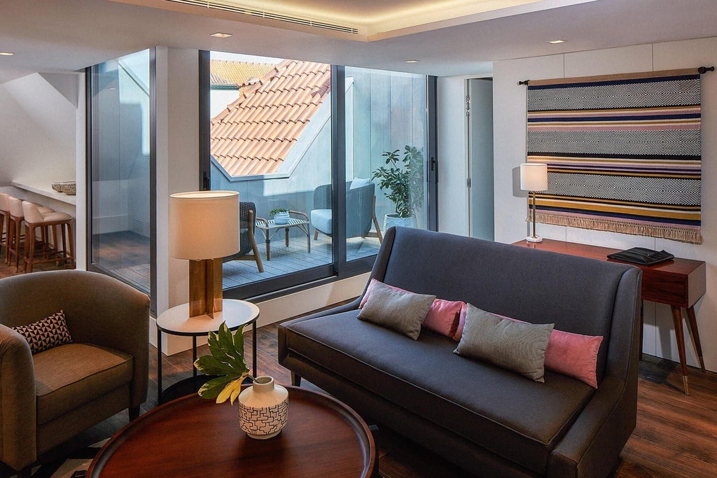 Spacious penthouse suite at The Lumiares Hotel & Spa, featuring modern design, panoramic city views, and elegant minimalist decor in Lisbon, Portugal.