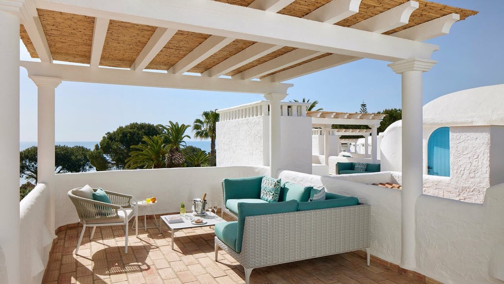 Luxurious rooftop suite at Vila Vita Parc Resort with panoramic ocean views, elegant contemporary design, and private terrace overlooking Algarve coastline