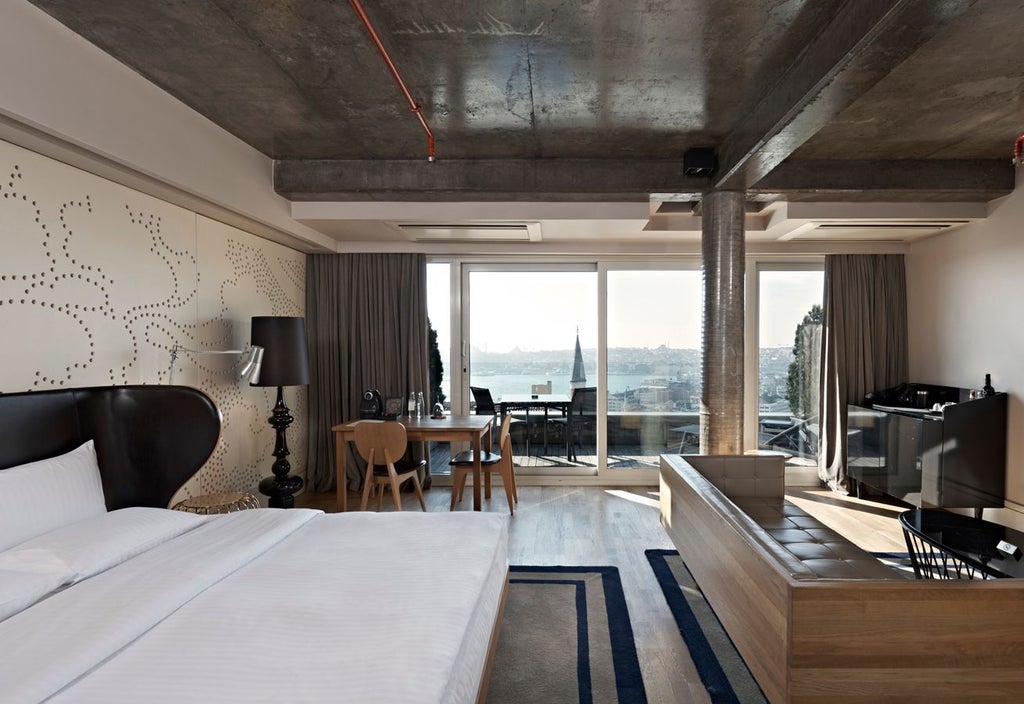 Luxurious boutique hotel in Istanbul with modern architecture, sleek design, and elegant minimalist interior featuring warm neutral tones and contemporary furnishings