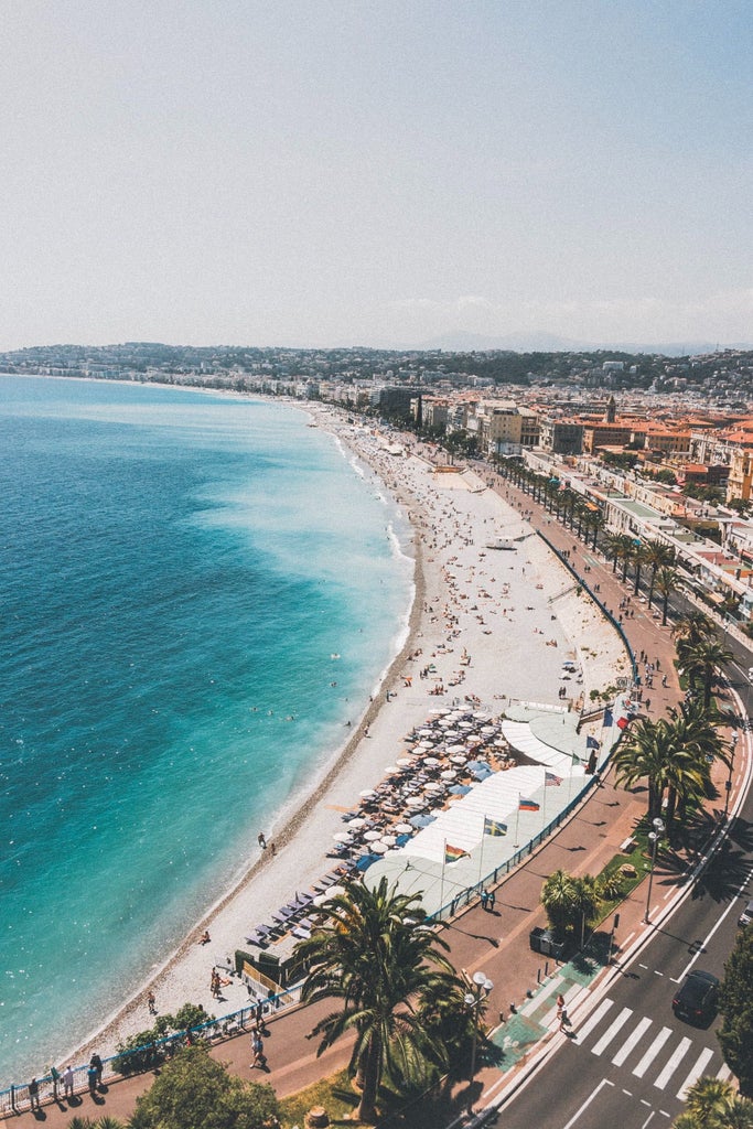 Vibrant coastal view of Marseille's Vieux Port and Nice's Promenade des Anglais, showcasing luxury yachts and azure Mediterranean waters