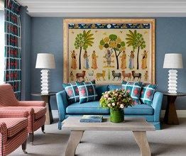 Elegant boutique hotel lobby with vibrant mid-century modern design, featuring plush seating, colorful artwork, and sophisticated contemporary decor in United Kingdom