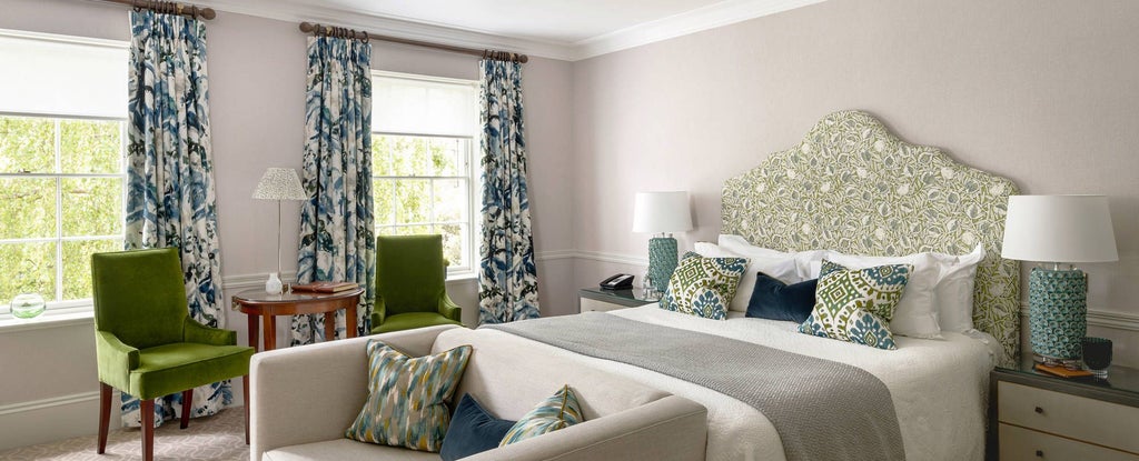 Elegant heritage bedroom at Royal Crescent Hotel & Spa, featuring classic period furnishings, soft neutral tones, and refined Georgian architectural details