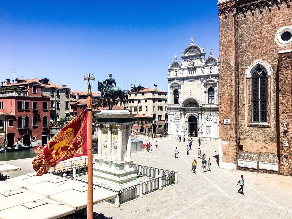 Luxurious Venetian-style suite in Palazzo Cristo, featuring elegant marble floors, antique furnishings, and soft natural light in Castello, Venice