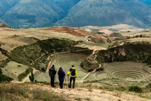 Luxurious Explora Hotel nestled in Peru's Sacred Valley, panoramic Andean peaks, stone architecture blending with dramatic mountain landscape