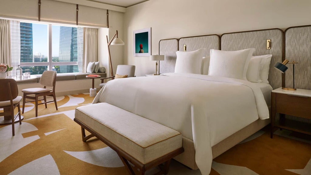 Spacious Four Seasons accessible hotel room in Miami with elegant design, panoramic city views, modern amenities, and sophisticated neutral color palette