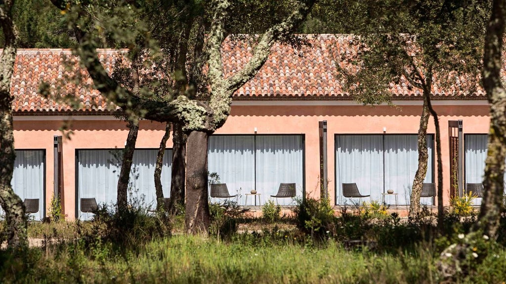 Minimalist bio-pool suite at Sublime Comporta Hotel, featuring sleek design, natural wood tones, and expansive glass walls overlooking pristine Portuguese landscape