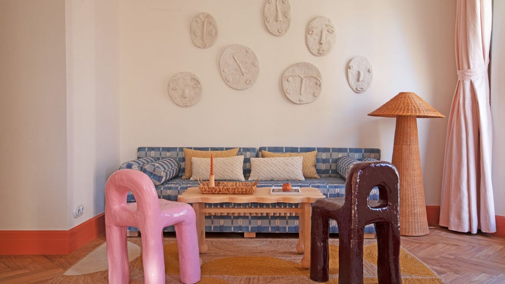 Elegant Dalt Vila Suite at Montesol Experimental, featuring minimalist white decor, panoramic Ibiza views, and sleek contemporary design with natural light