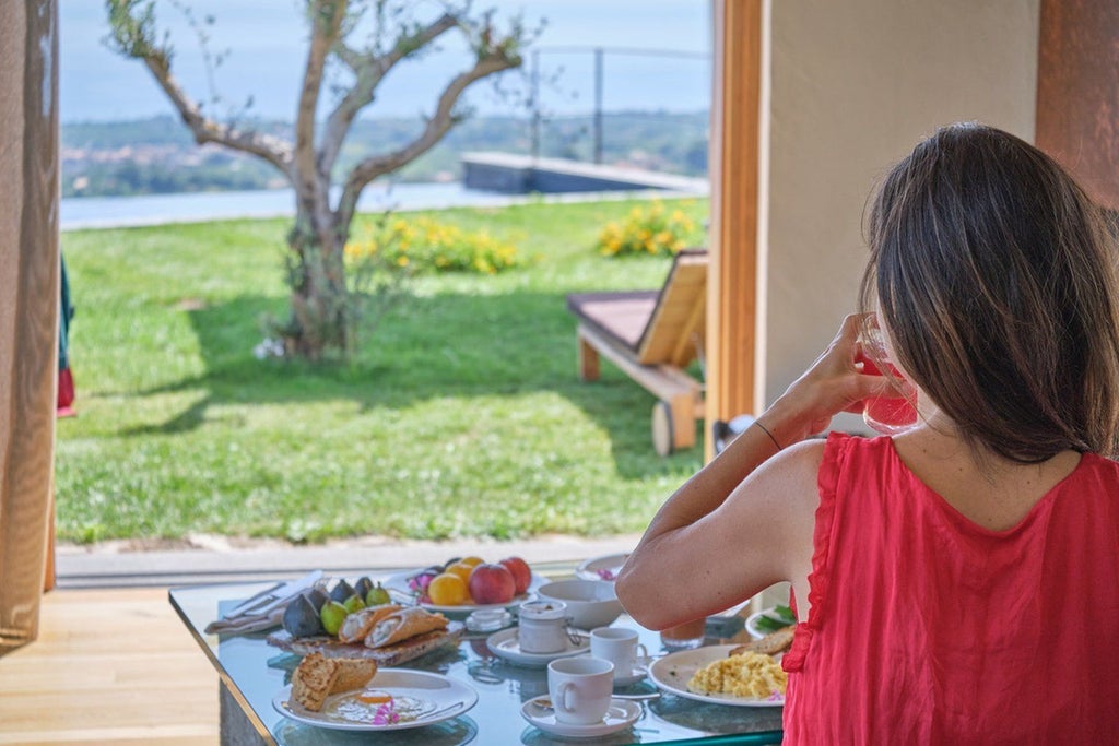 Luxurious two-bedroom pool villa at Monaci delle Terre Nere, featuring elegant Sicilian design with natural wood accents and panoramic countryside views