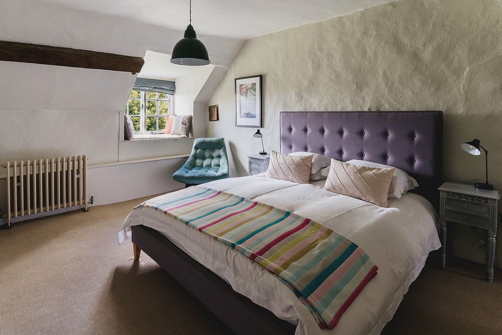 Luxurious stone farmhouse hotel nestled in lush United Kingdom countryside, featuring traditional architecture with elegant rustic charm and verdant landscape surroundings