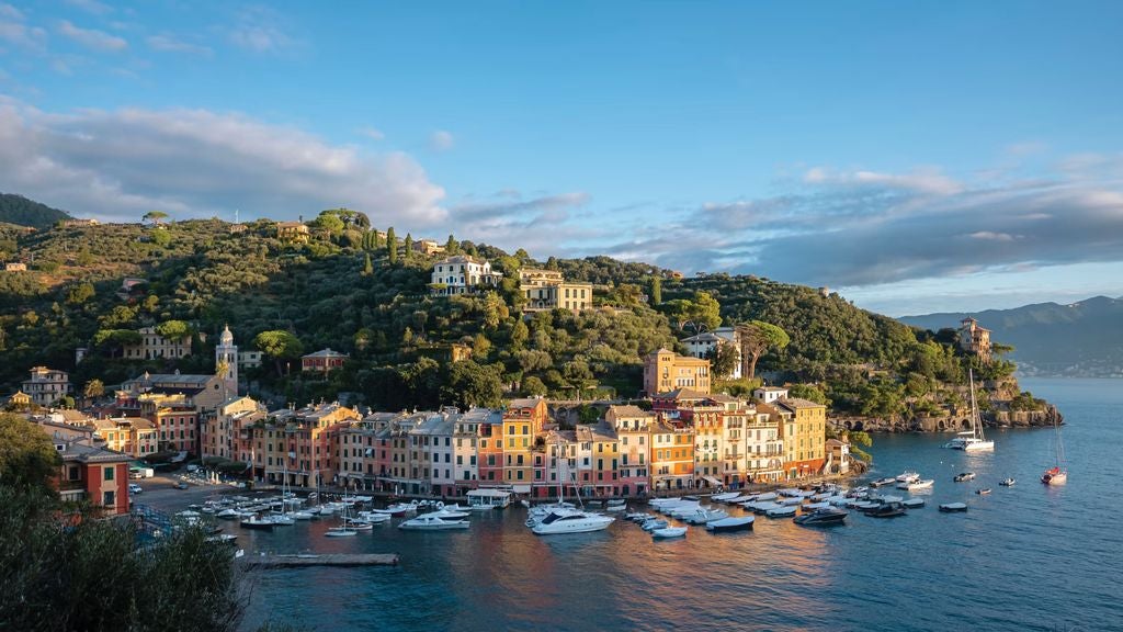 Elegant beachfront hotel with panoramic Mediterranean views, white marble terraces and infinity pool overlooking the Amalfi coastline