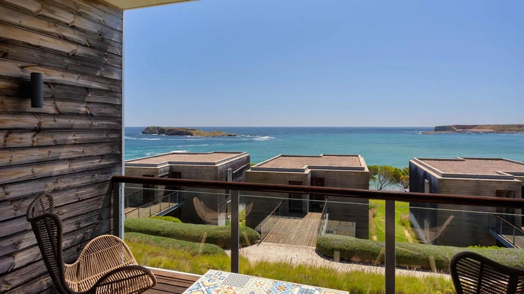 Luxurious Beach Suite with panoramic ocean view, modern minimalist design, light-filled interior, and contemporary coastal Portugal aesthetic